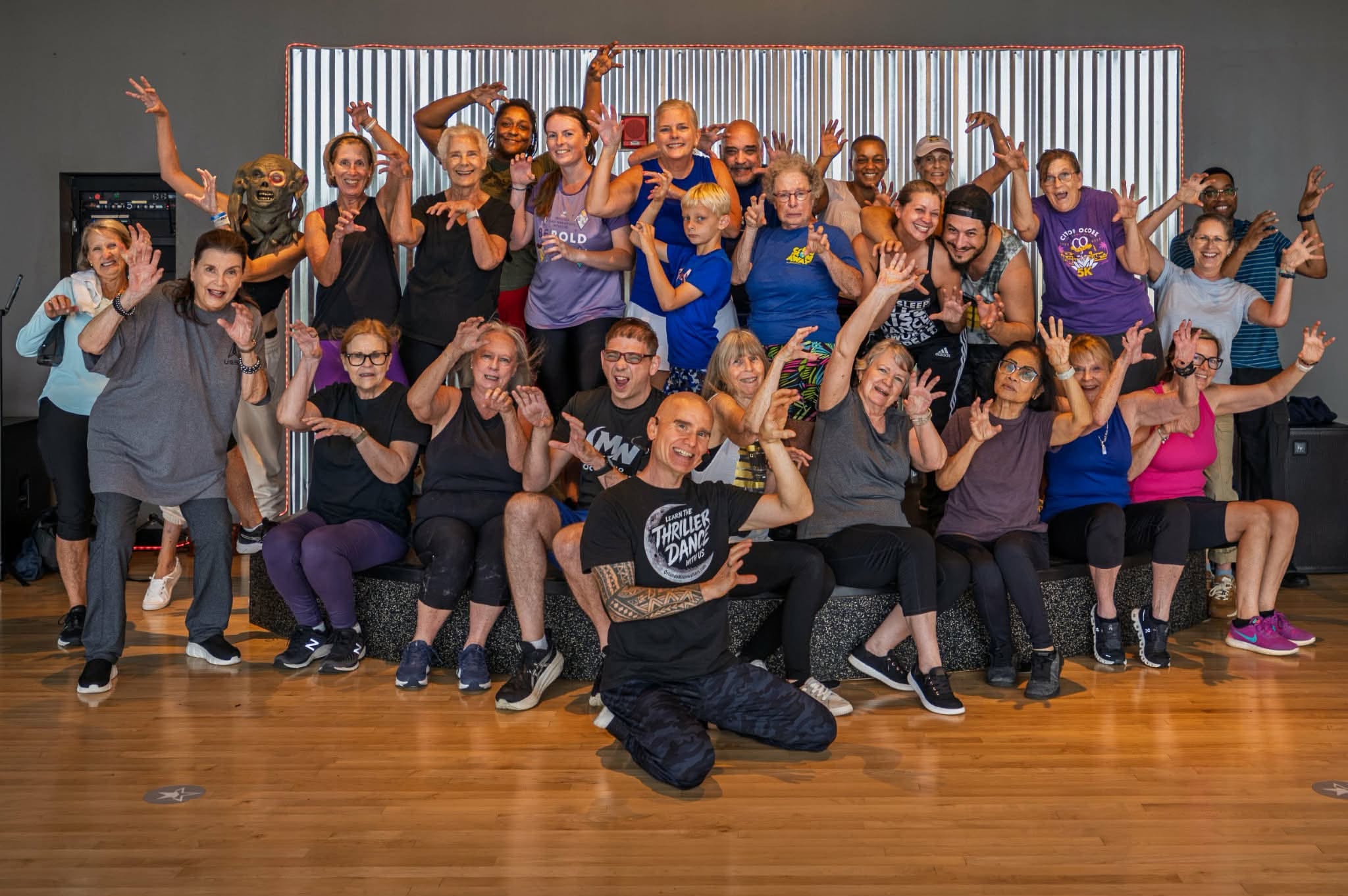 Frank leading a Thrill the World dance class